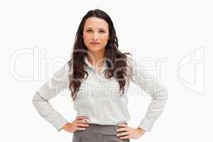 Portrait of a brunette businesswoman hands on hips