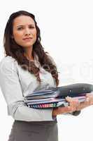 Portrait of a brunette carrying heavy files