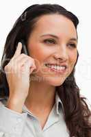 Close-up of a brunette smiling while calling