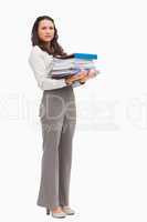 Woman carrying a lot of files