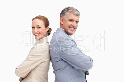 Portrait of happy business people back to back