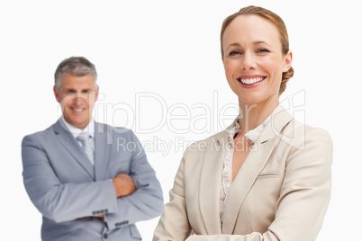 Happy business people with folded arms