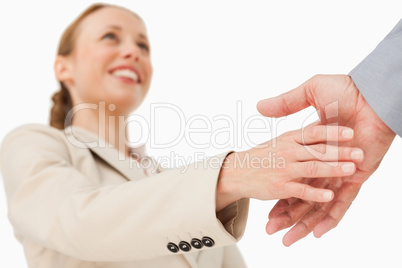 Low angle-shot of a woman shaking hands
