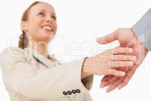Low angle-shot of a woman shaking hands