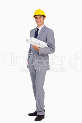 Man in a suit with safety helmet and plans