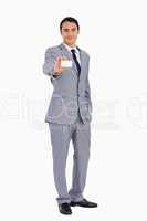 Good-looking man showing his business card