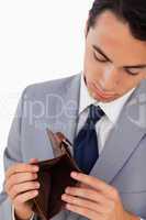 Man in a suit showing his empty wallet
