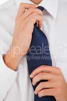 Man tightening his tie
