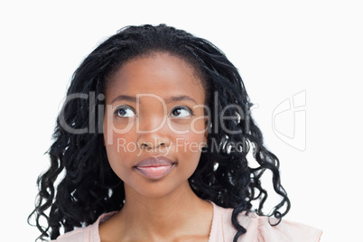 Head shot of a young woman looking away from the camera