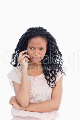 An angry woman talking on her mobile phone