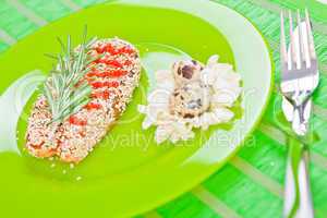 fish with sesame on a green plate