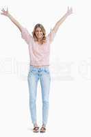 full length shot of a smiling woman with her arms raised up