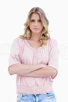 Woman staring at the camera with her arms folded