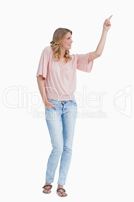 Smiling woman pointing her finger