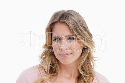 Serious young blonde woman looking at the camera