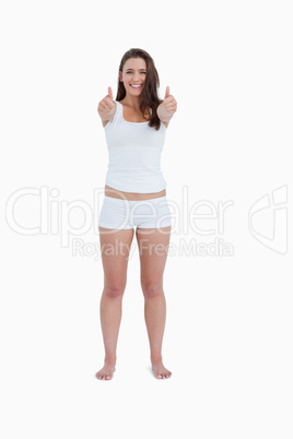 Happy woman placing her thumbs up