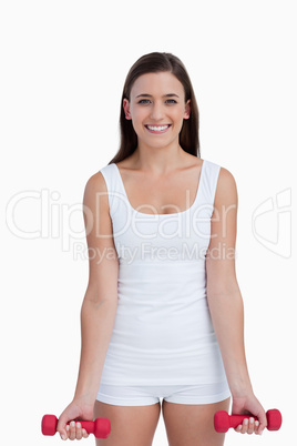 Smiling woman holding weights
