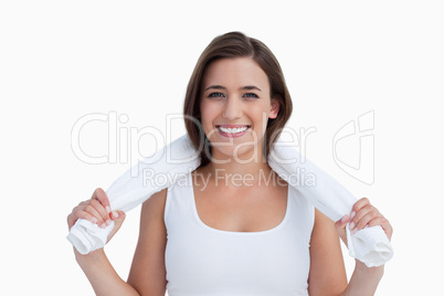 Young woman holding a towel around her neck