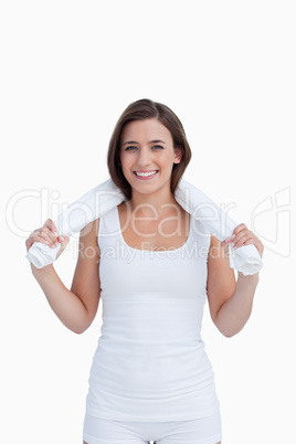 Smiling brunette holding a white towel Smiling brunette holding a white towel