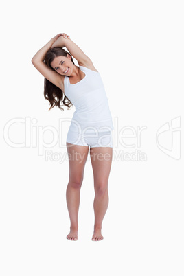 Smiling woman stretching herself