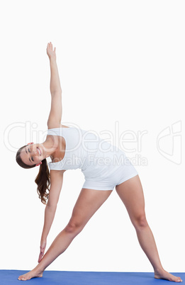 Smiling woman practicing yoga