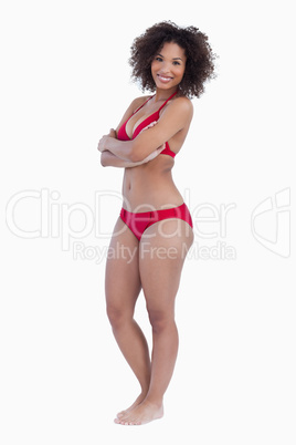 Smiling woman posing with arms crossed