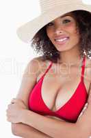 Smiling young woman wearing a straw hat