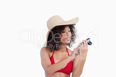 Attractive woman looking at her digital camera