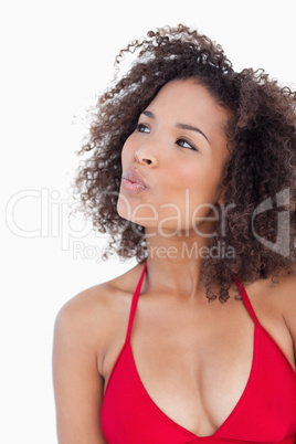 Attractive brunette woman puckering her lips