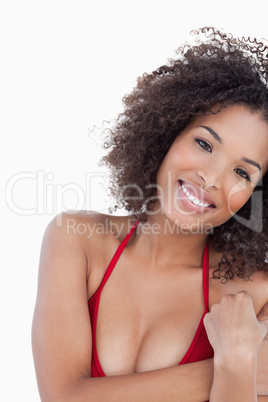 Smiling young brunette woman looking at the camera