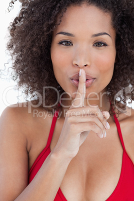 Attractive brunette woman asking for silence