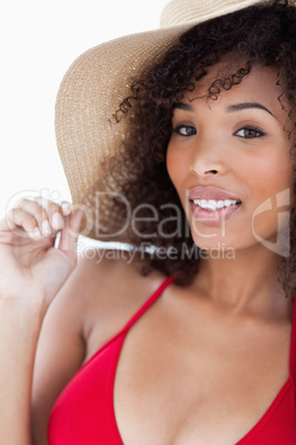 Smiling young woman in swimsuit looking at the camera