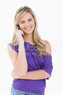 Happy blonde woman using her cellphone Happy blonde woman using her cellphone