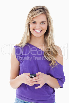 Smiling blonde woman looking at the camera while holding her mob