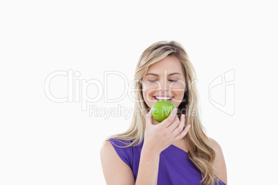 Smiling woman holding a delicious apple