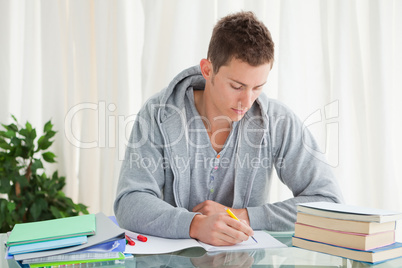 Male student doing his homework