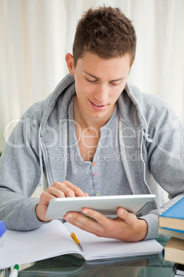 Smiling student using a touch pad