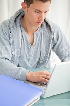 Close-up of a student using a laptop