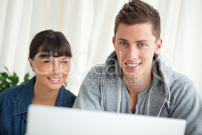 Portrait of two smiling students working together