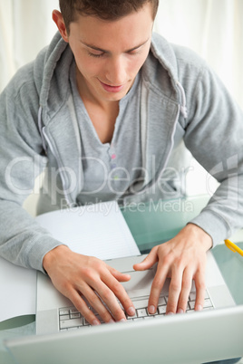 Close-up of a happy student doing homework