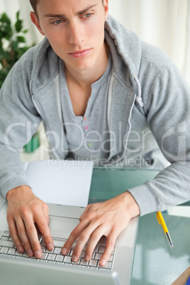 Student Frowning while doing his homework