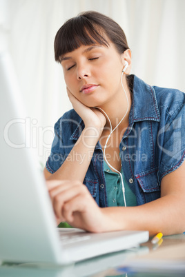 Female student falling asleep while doing her homework