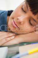 Close-up of a smiling student sleeping