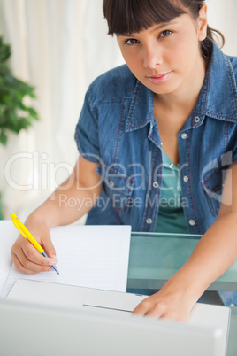 Portrait of a cute student doing her homework