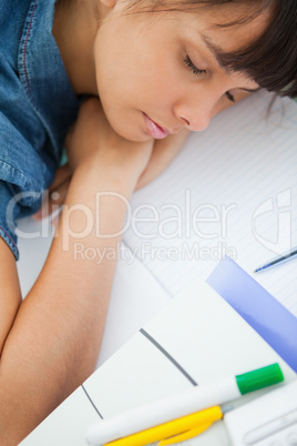 High-angle view of a female student sleeping