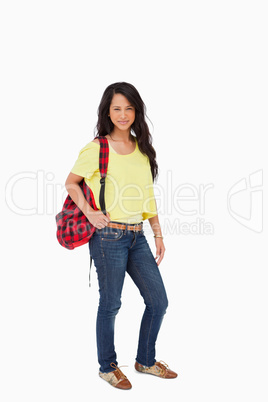 Pretty Latin student posing with a backpack