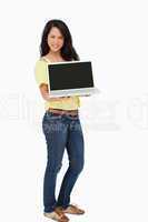 Beautiful Latin student showing a laptop screen