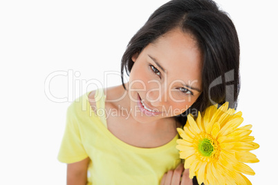 High-angle view of a Latino woman holding a gerbera