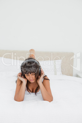 Sexy young woman listening to music