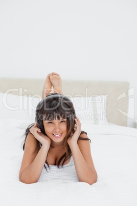 Smiling young woman listening to music